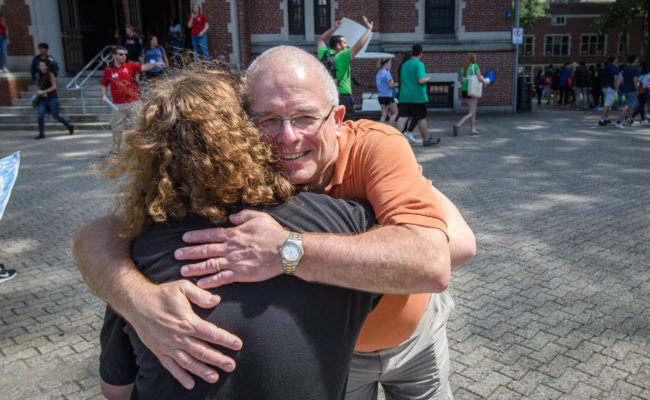 father hugging daughter