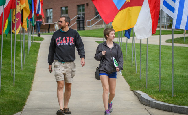 girl walking down path with fath