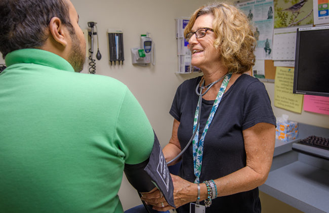 Nurse taking pressure of a studen