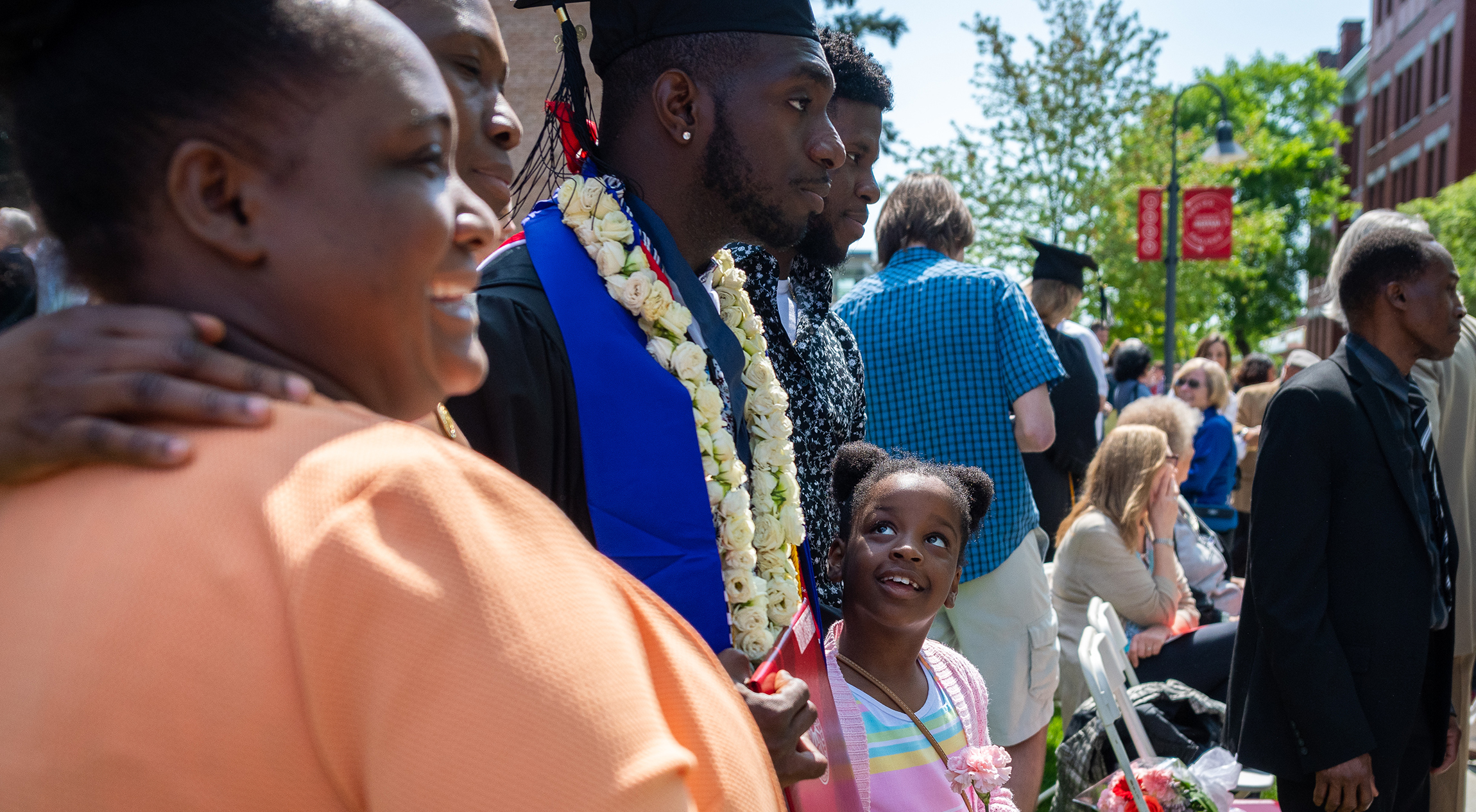 family celebrating commencement with son