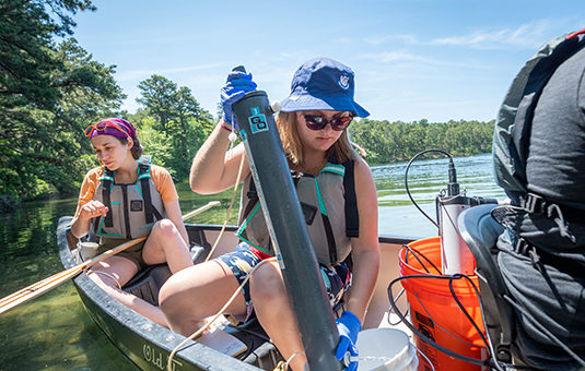 Students testing in kettle pond