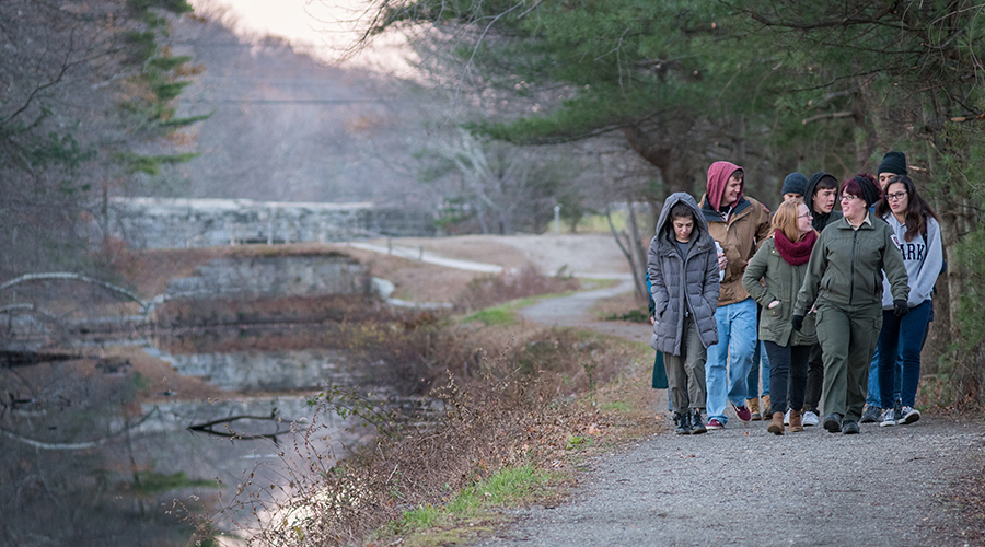 students walking near river