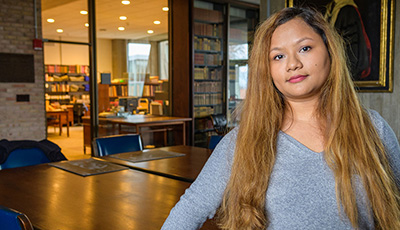 Student standing in office