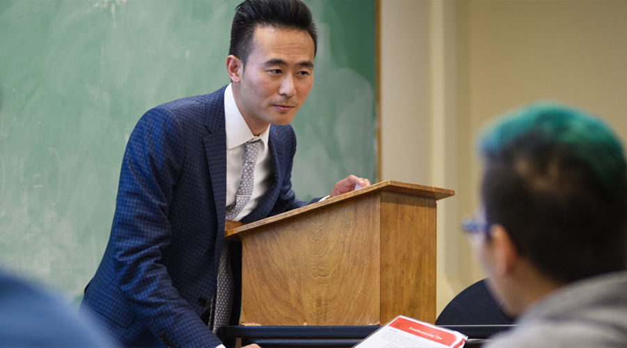 faculty member at podium