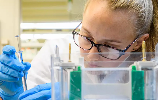 female student in chemistry lab