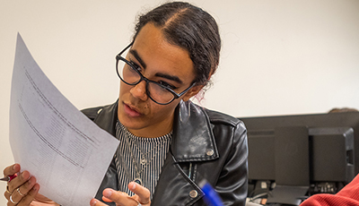 student looking at paper