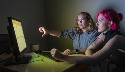 two students working on computer together