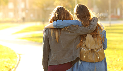 college students with arms around each other