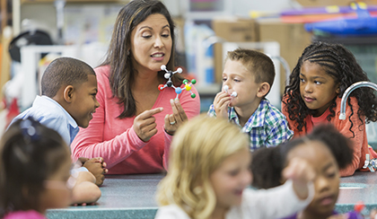 teacher with multiracial group of students