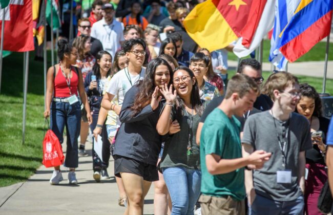 Students waving