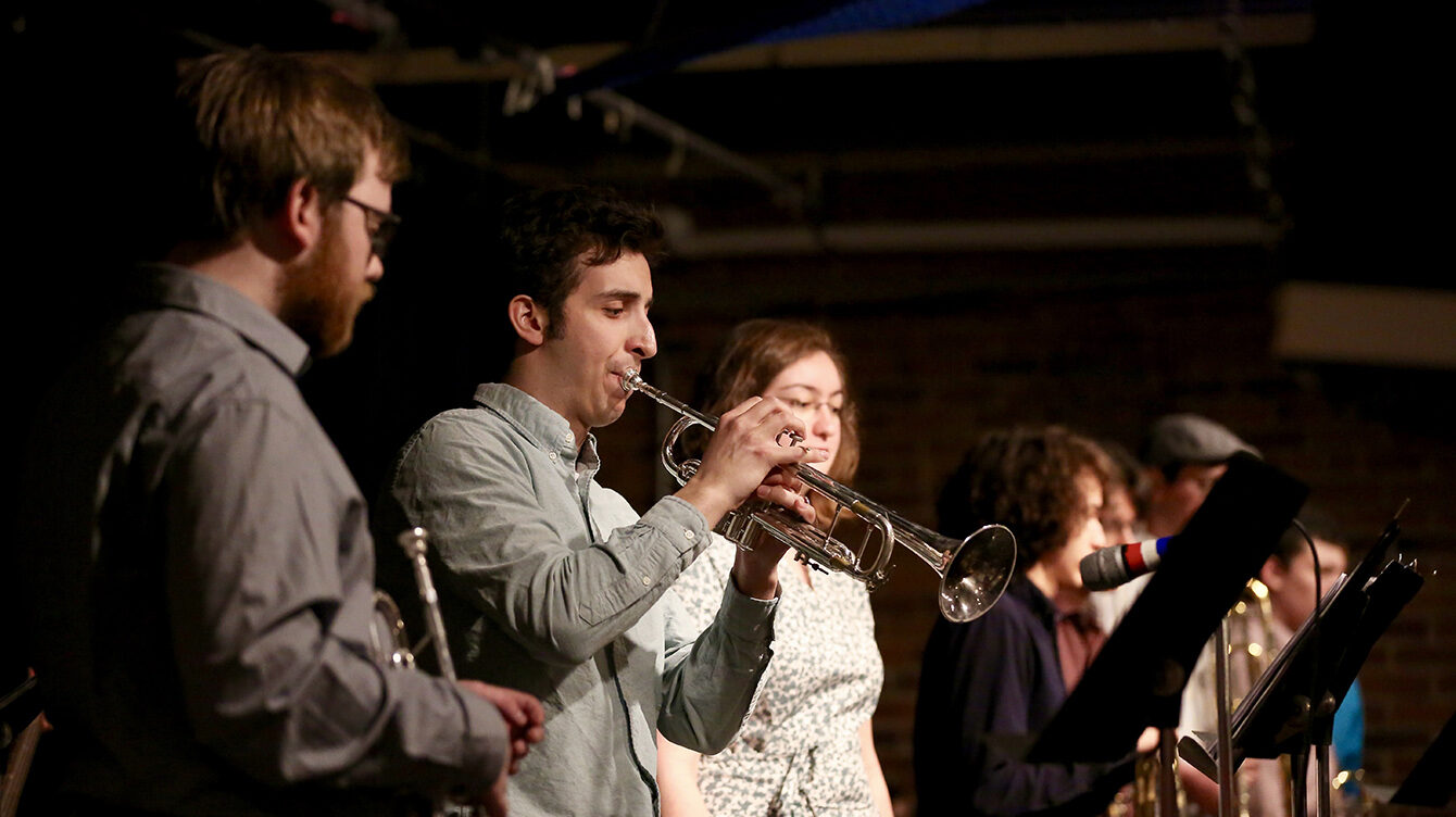 students playing instruments on stage