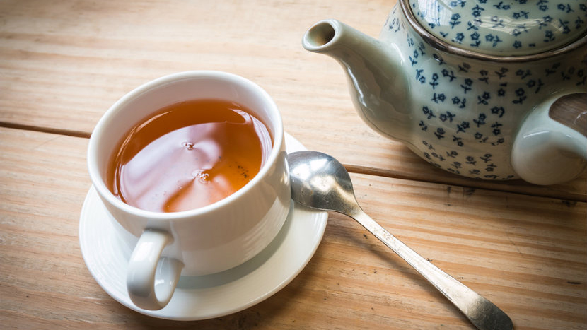 Teapot with cup and spoon