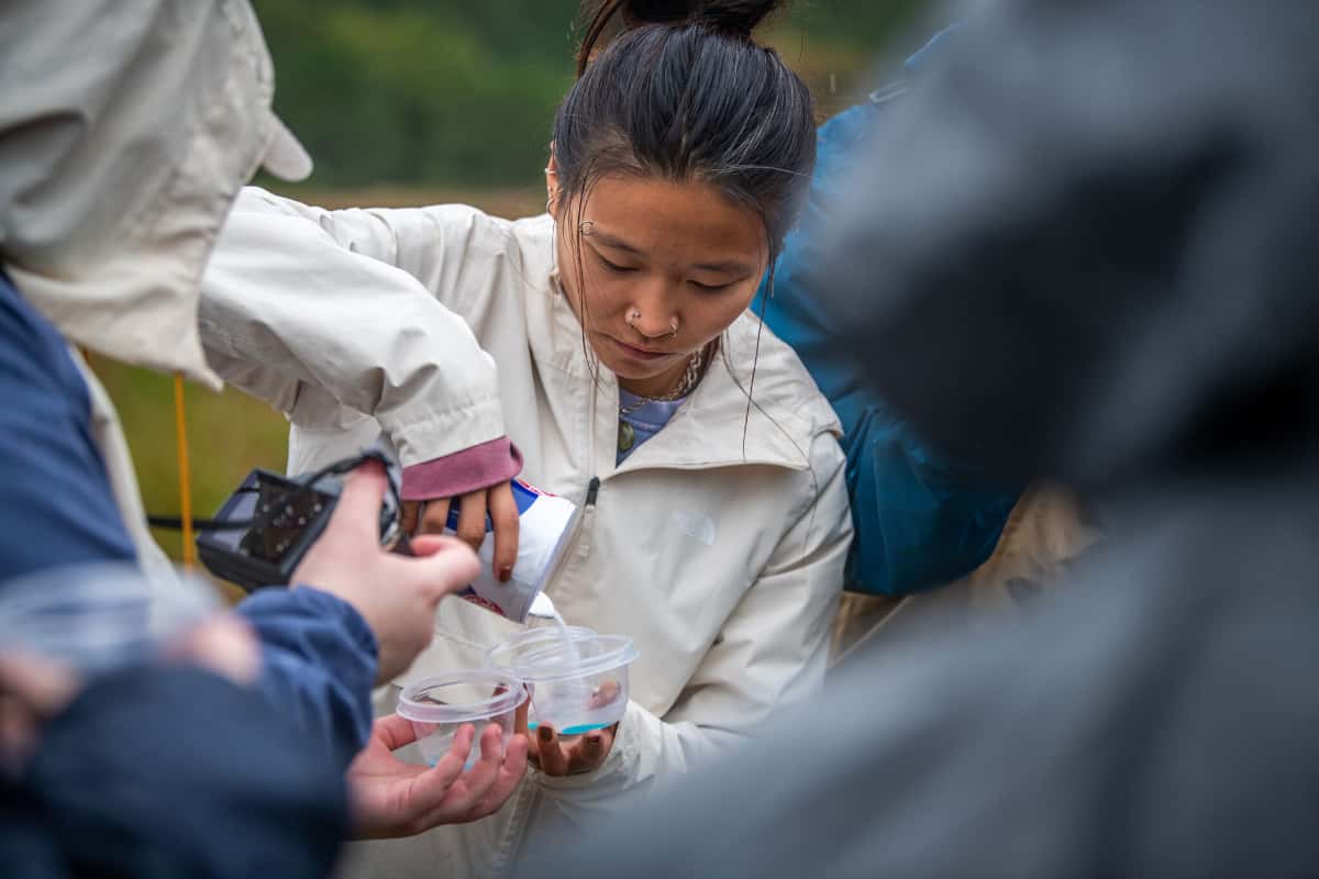 A student performs fieldwork.