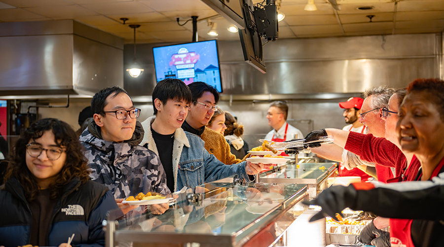 Students getting late night breakfast at the Higgins cafe