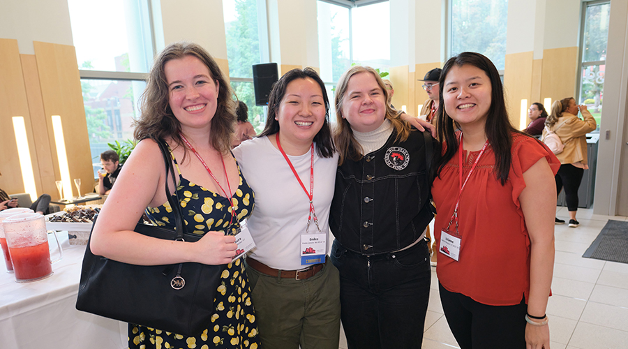 Group of alumni with name tags at reunion weekend