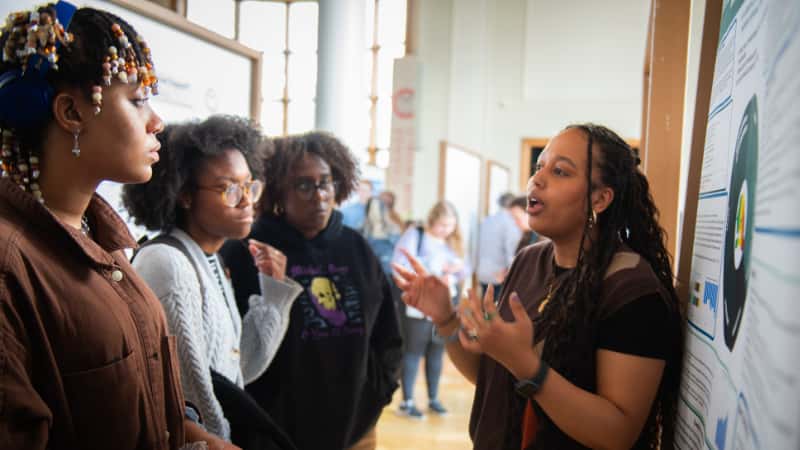 a student presents her research at ClarkFEST