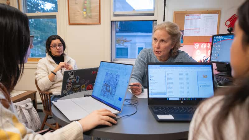 Professor Yelena Ogneva-Himmelberger meets with students during office hours.