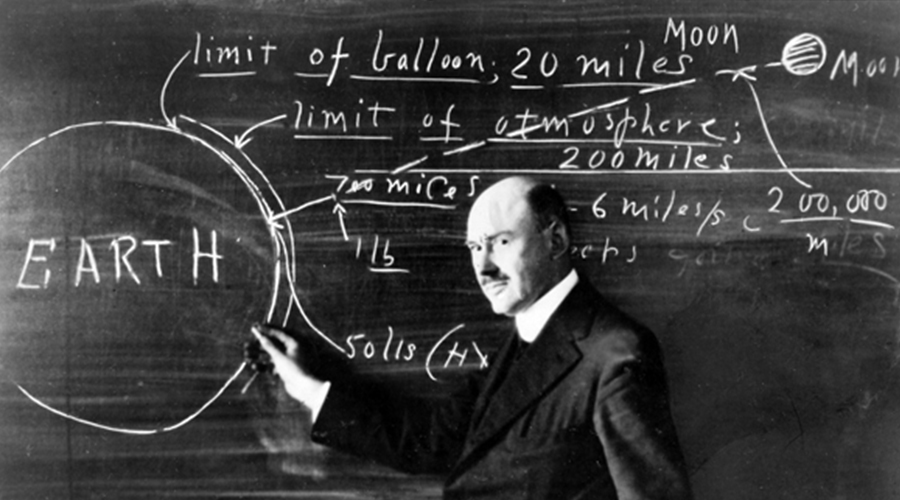 Robert Goddard in front of blackboard