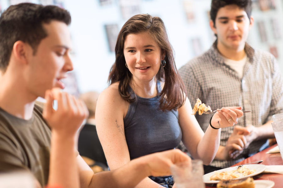 Students eating at Annie's Clark brunch