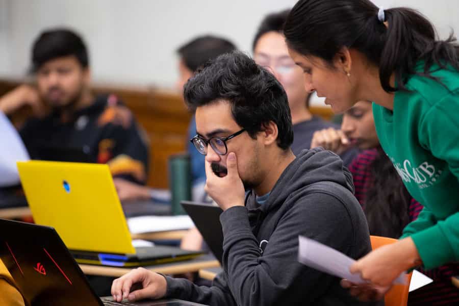 students collaborate in business intelligence class