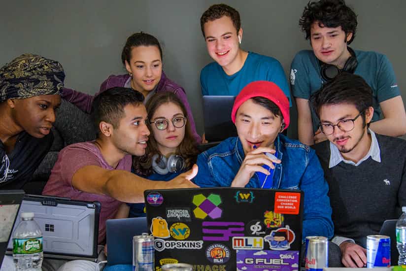 students collaborate on the computer