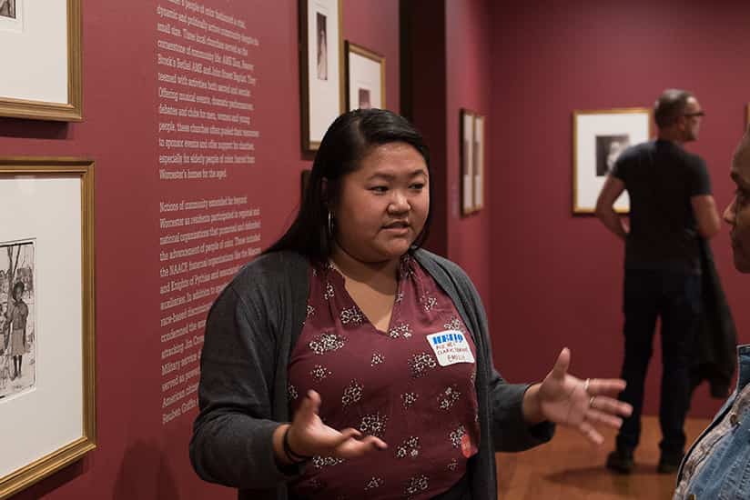 a students works as a museum guide