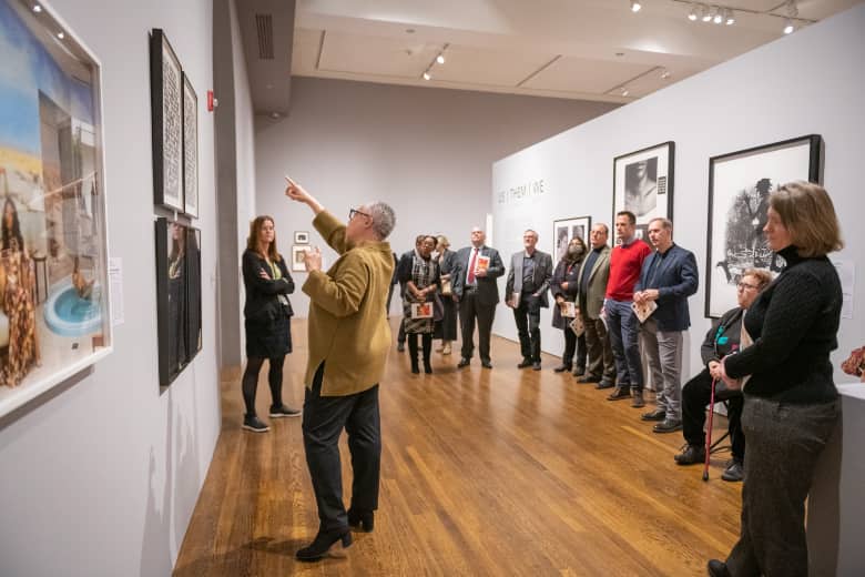 Professor Toby Sisson guides a tour of the exhibition 