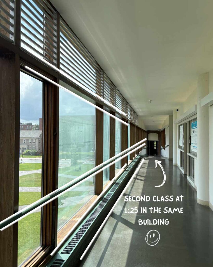 Turna Barua ’26 Day in the Ƶ series: corridor in an academic building with handwritten accent "second class at 1:25 in the same building."