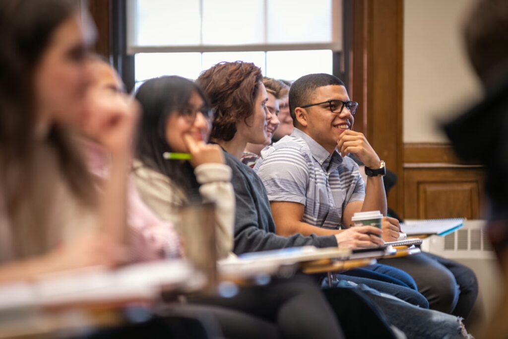 A student participates in a class discussion in a marketing class in the Business School
