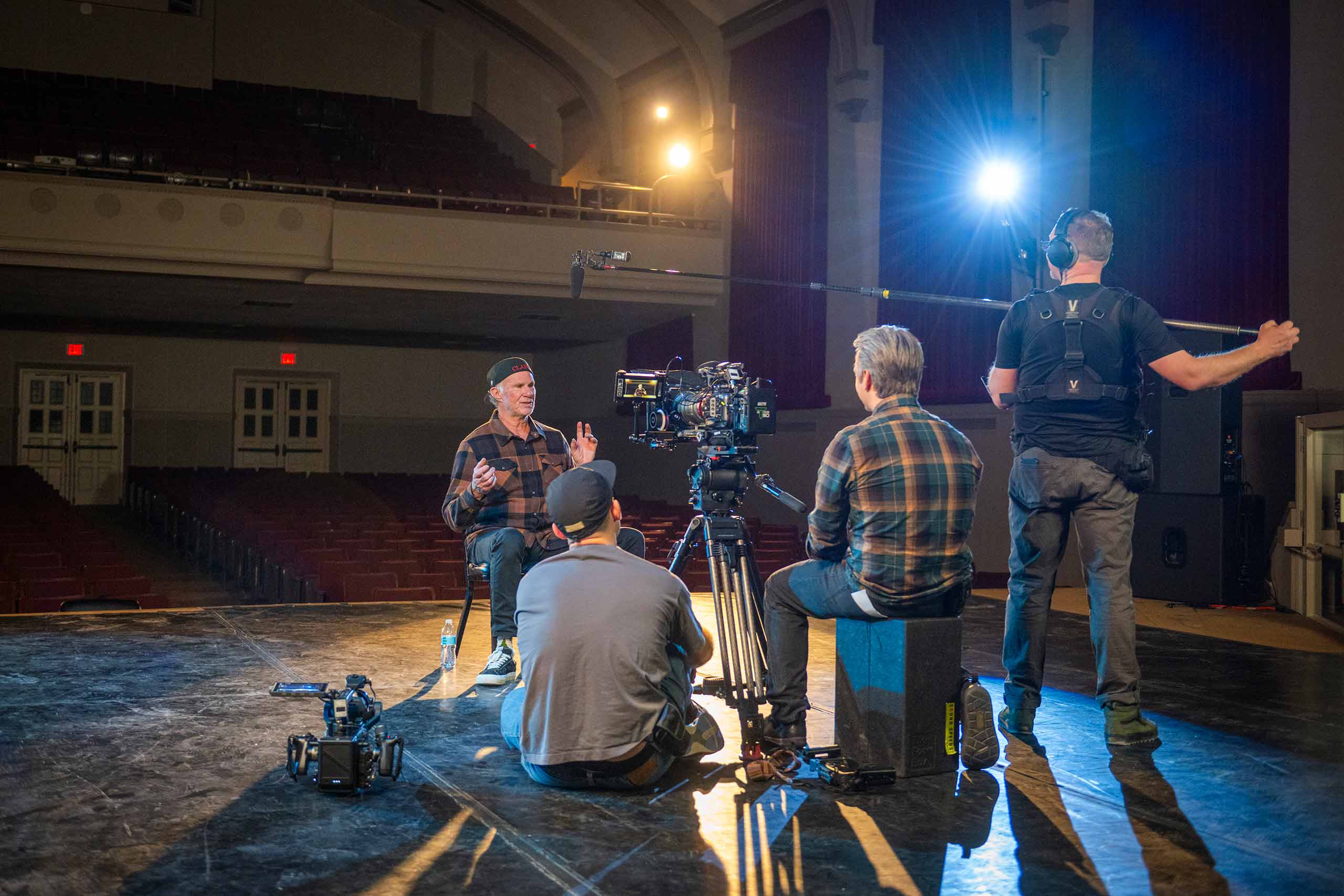 Chad Smith speaking to videographers on stage at Atwood Hall, the site of many famous musical performances.