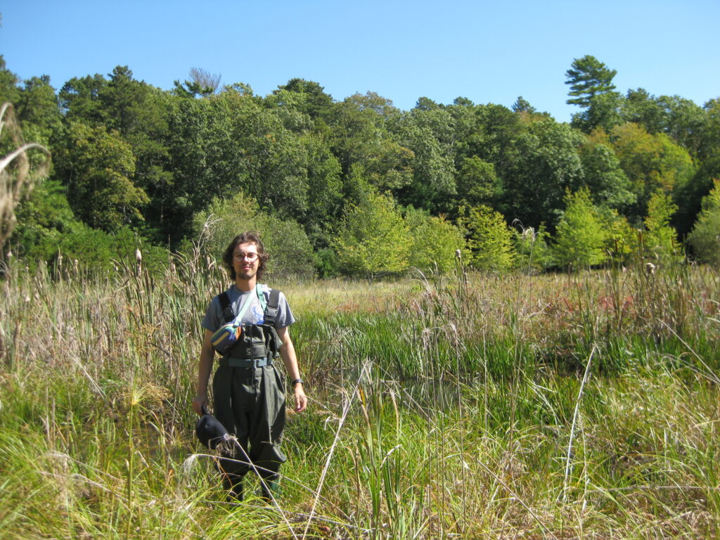 Leo Kerz '26 conducts acoustic monitoring of  restored Massachusetts wetlands.