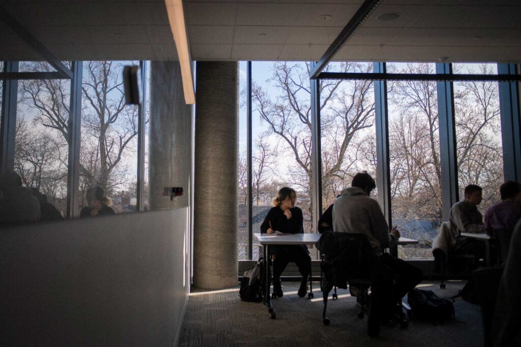 Computer science students work on a group project at Clark University