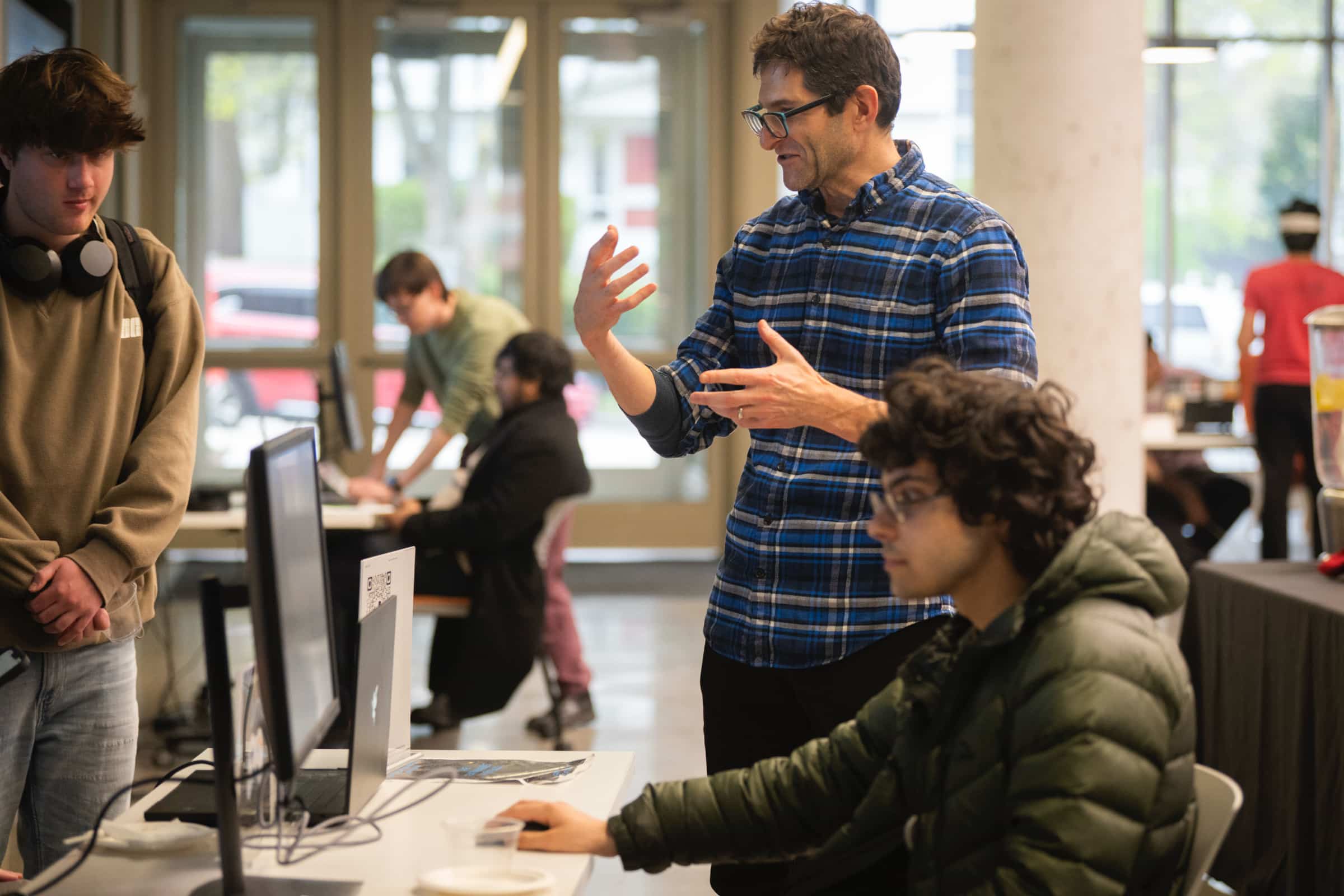 Professor Ezra Cove works with students