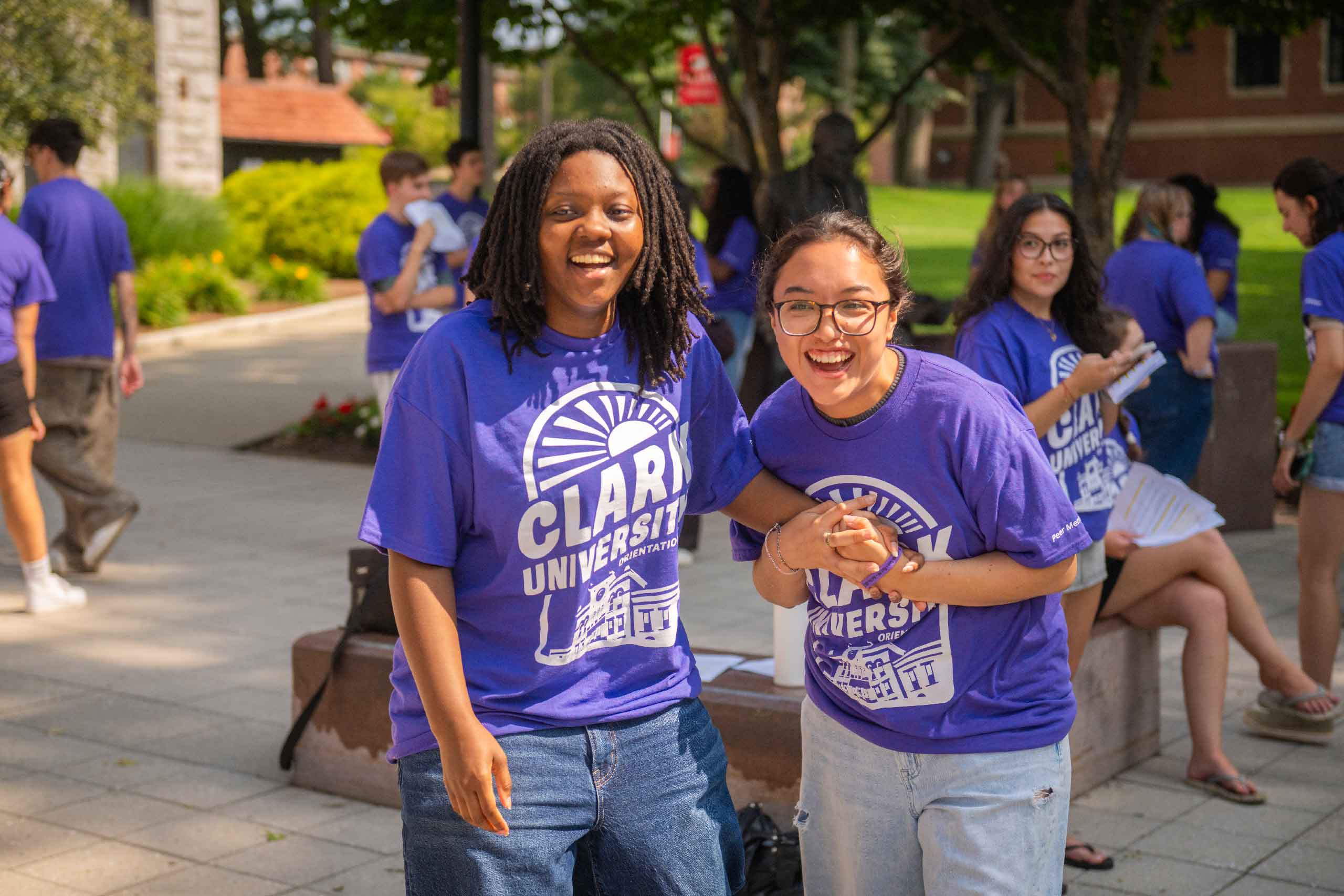 Peer mentors grab hands and pose for a picture during a break from training.