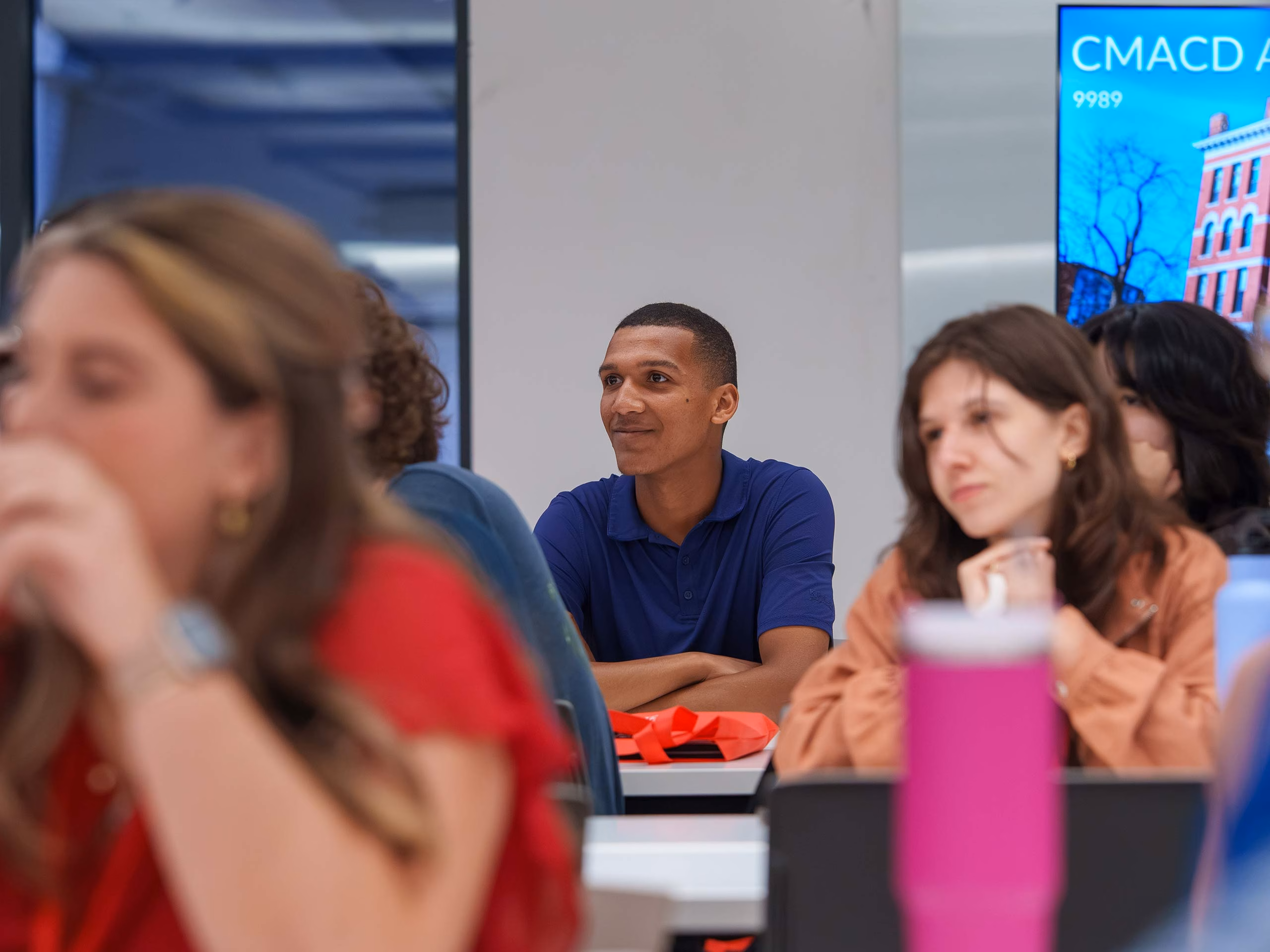A student smiles as they attend a Sophomore Summit career event at Clark University