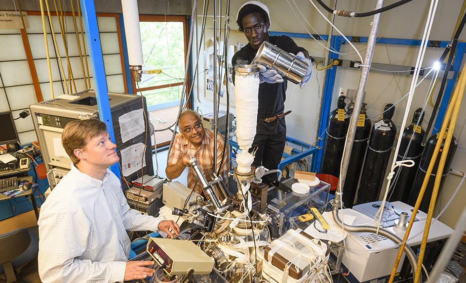 student and professor working on lab