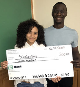 Valerie Diaz and Nana Lokko holding check