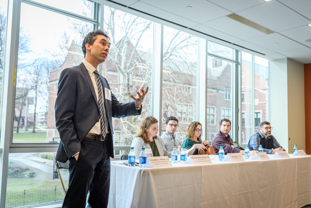 Professor Christopher Williams standing in front of audience