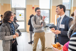 Students talking to guest speaker