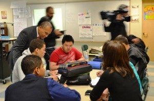 Gov. Deval Patrick visits with students at the Claremont Academy