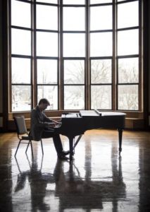 John Aylward playing Piano