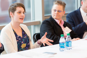 professionals sitting at table discussing subject matter