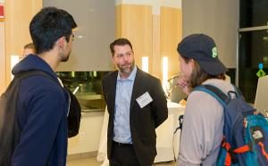 Kenneth Chase pictured talking to students