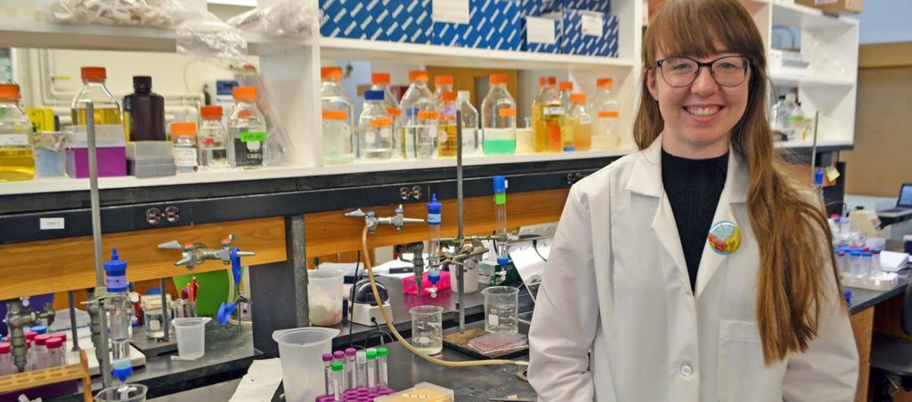 Rachel Orlomoski standing in the chemistry laboratory at Clark University