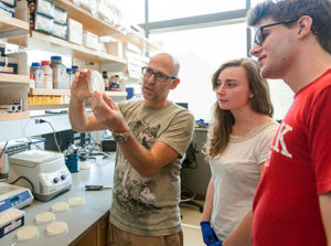 Professor Robert Drewell, left, with undergraduate students Arianna Brugnola and Luke Nourie.