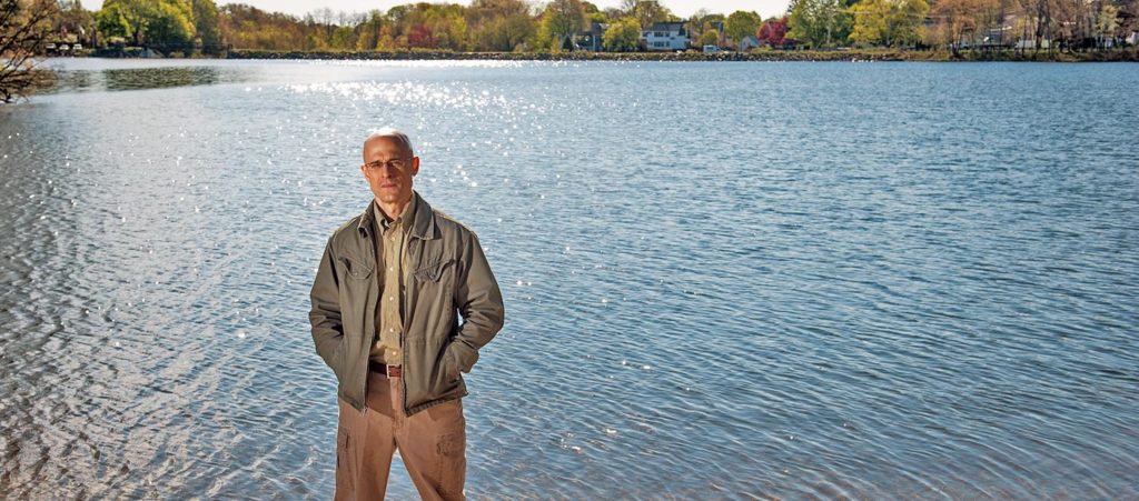 Robert Johnston standing in front of pond