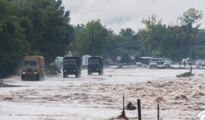 National Guard trucks enter Lyons, Colo. in the days after the flood. Courtesy Kenneth Wajda Photography