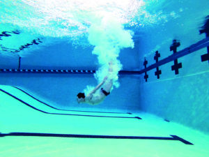 Steve Castiglione dives in a pool