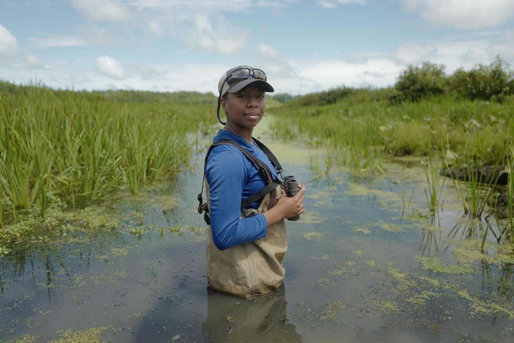 Olivia Barksdale standing in swamp