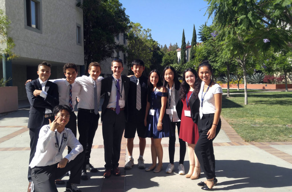 Curan A. VanDerWielen poses with students from UCLA